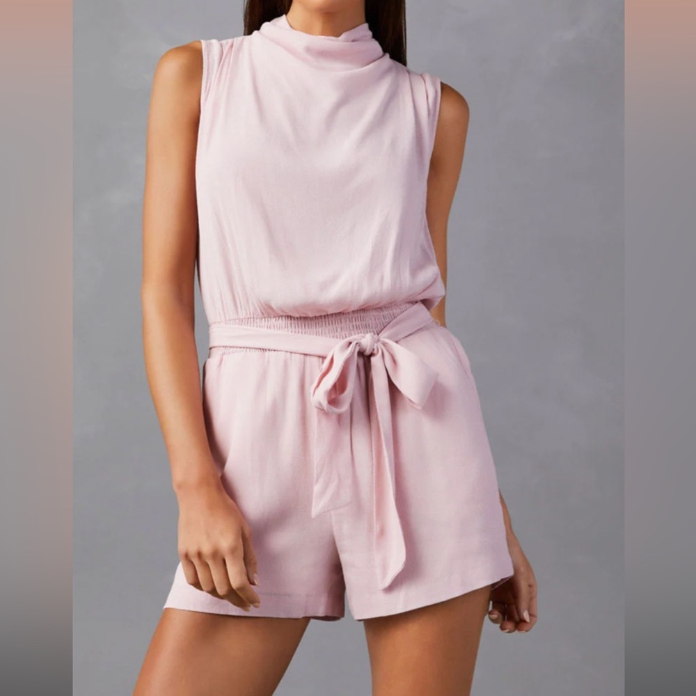 Elegant high neck, pocketed romper!